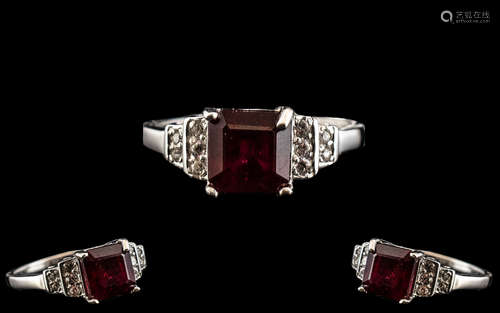 Ruby and Zircon Ring, a square cut, 2.5ct ruby solitaire set...