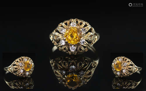 A 9ct Gold Dress Ring set with white faceted and Citrine col...