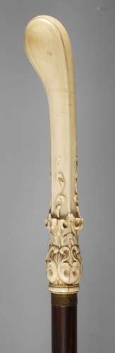 Canne en ivoirec. 1830, manche effilé, finement sculpté de f...