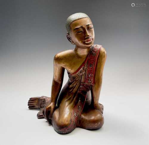 A Burmese giltwood figure of a monk, early 20th century, hei...