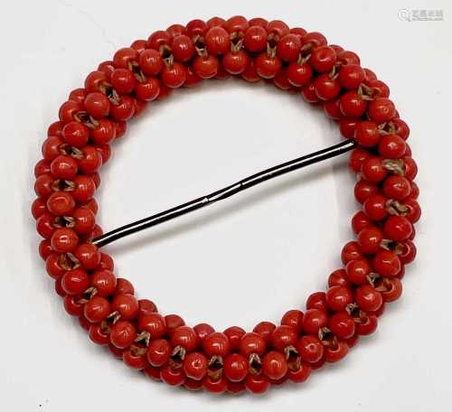 A Chinese red coral hair ornament, 19th century, diameter 6....