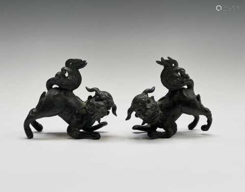 Two similar Chinese bronze scroll weights, 19th century, in ...