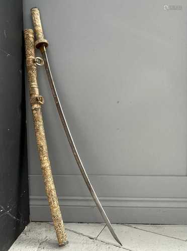 A Japanese carved ivory Samurai sword, Meiji Period, the 92c...