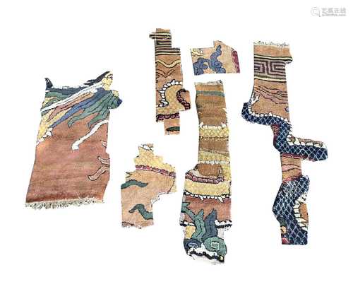 A quantity of Chinese rug fragments, 19th century.