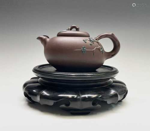 A Chinese yixing teapot, seal mark to base and signed on han...