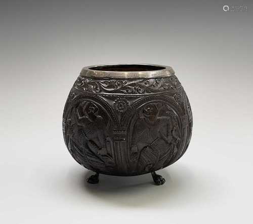 A carved coconut cup, with silver rim, Birmingham 1911 hallm...