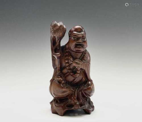 A Chinese carved hardwood figure of buddha, early 20th centu...