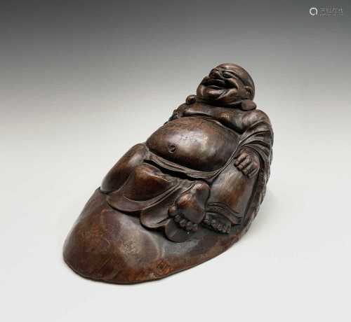 A Chinese bamboo figure of a reclining buddha, height 17cm, ...