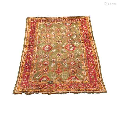 An Ushak carpet, West Anatolia, the green field with an all ...