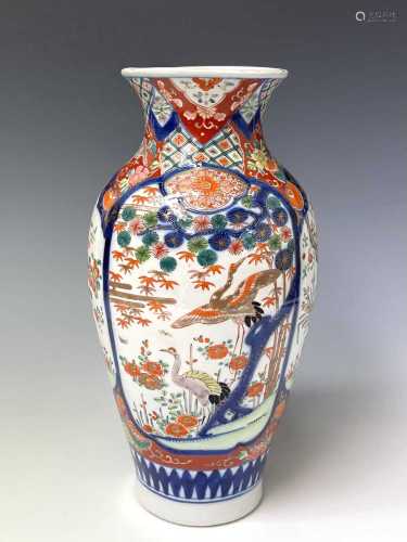 A Japanese Imari vase, circa 1900, painted in a typical pale...
