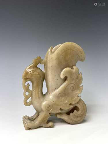 A Chinese carved jade rhyton, 20th century, the archaic form...