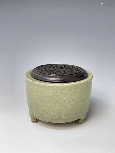 A Chinese longquan celadon tripod censer, Yuan Dynasty, toge...