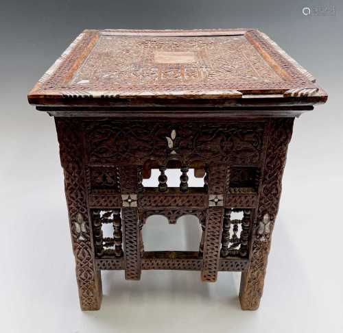 A Syrian carved wood occasional table, 19th century, the top...