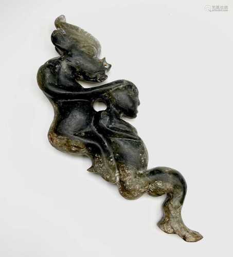A Chinese nephrite jade carving of a demon and female, possi...