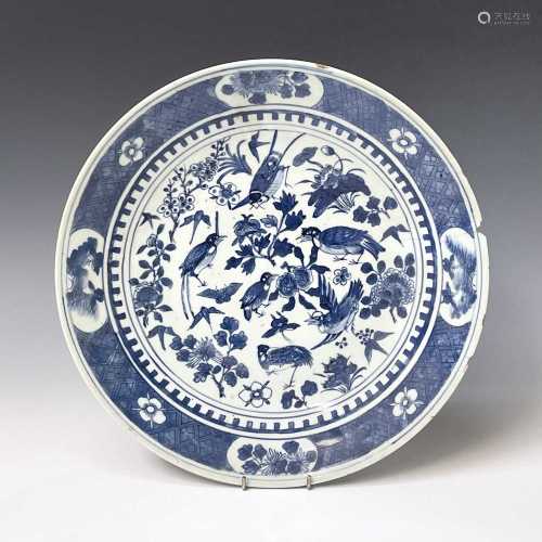 A Chinese porcelain blue and white charger, 19th century, de...