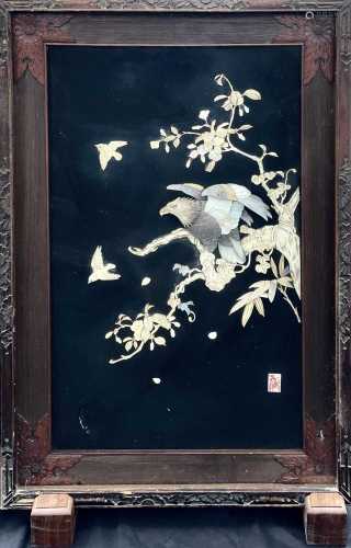 A Japanese black lacquer panel , Meji period, worked in moth...