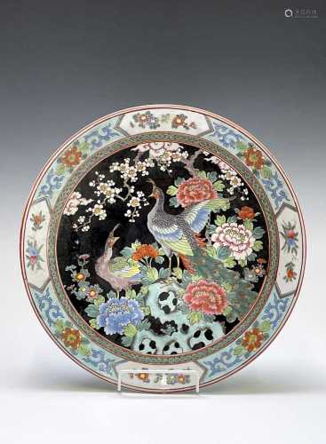 A Chinese famille noire porcelain charger, circa 1900, with ...