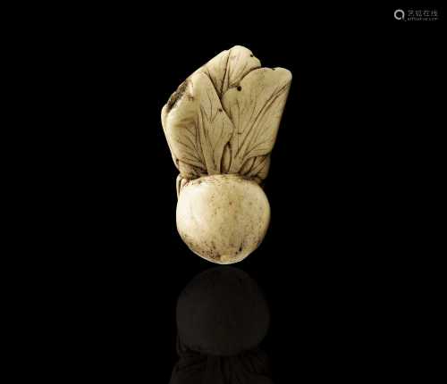 A Japanese carved bone netsuke of Pak Choi, 19th century, he...