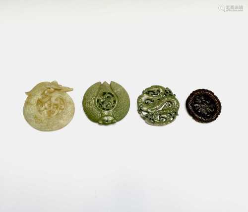 A Chinese jade carved disc, 20th century, decorated an entwi...