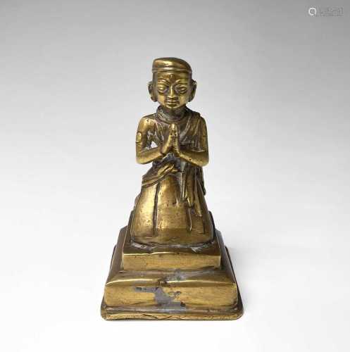 An Indian brass figure of a priest, probably 19th century, i...