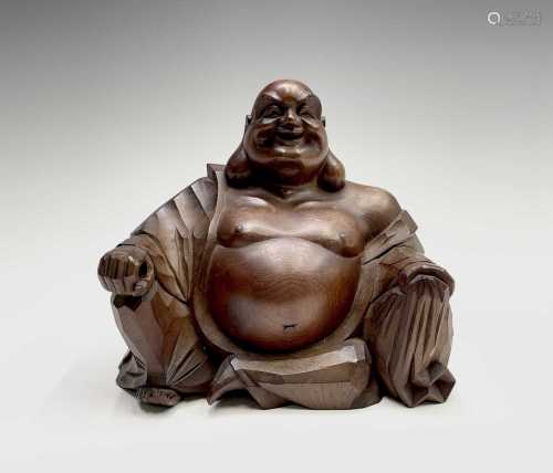 A Japanese boxwood figure of a seated Buddha, late 19th/earl...
