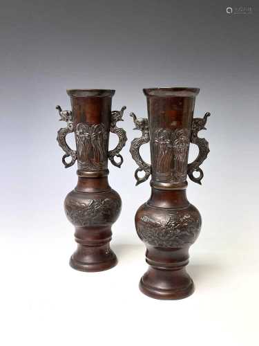 A pair of Japanese bronzed vases, with dragon mounted necks ...