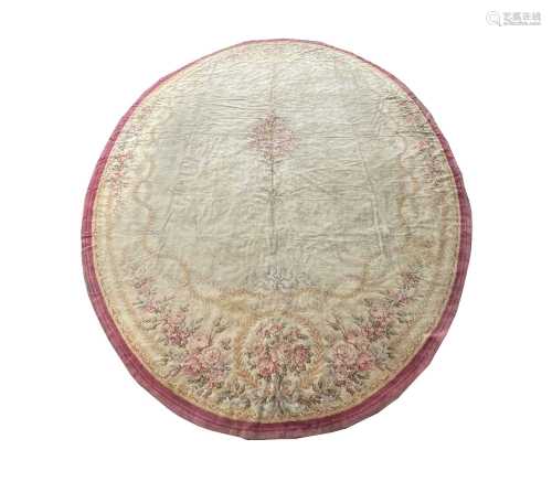 A large Donegal oval carpet, late 19th century, with a large...