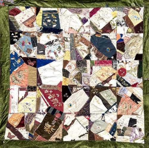A unusual patchwork quilt, circa 1920's, embroidered by a Fa...