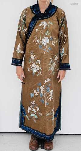 A Chinese silk embroidered robe, 19th century, decorated wit...
