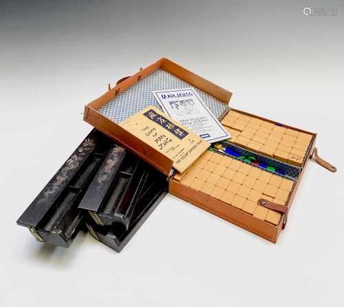 A Chinese cased mahjong set, with celluloid tiles and four b...