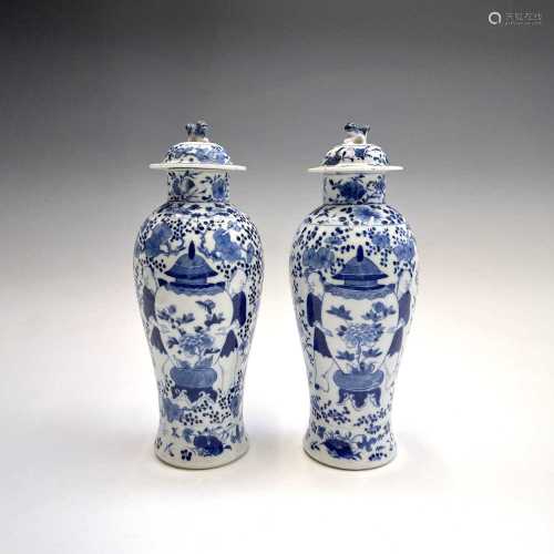 A pair of Chinese porcelain blue and white baluster vases an...