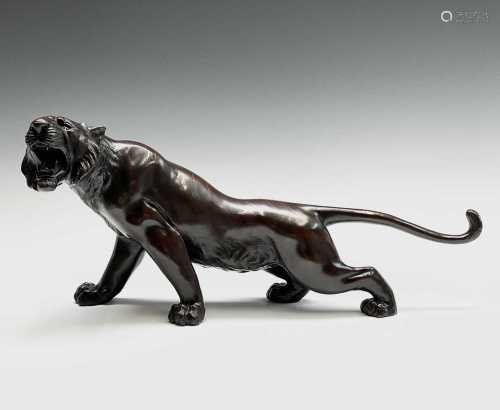 A Japanese bronze model of a tiger, Meiji Period, signed, he...