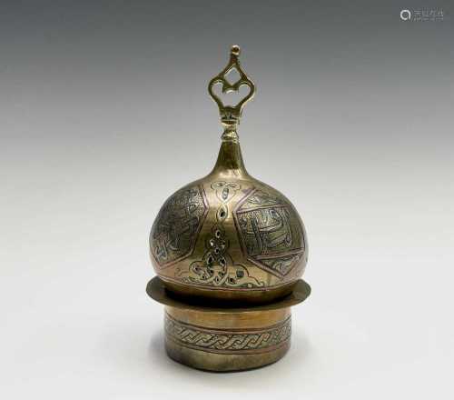 An Islamic Cairoware brass incense burner, circa 1900, the c...