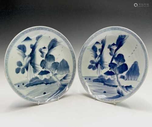 A pair of Japanese blue and white porcelain chargers, early ...