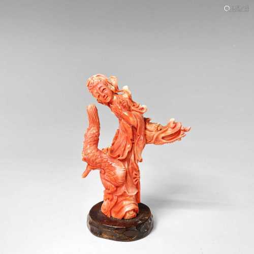 A Chinese carved coral figure of Guanyin riding a dragon, 19...