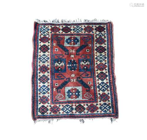 A Turkish rug, of Caucasian design, mid 20th century, the ma...