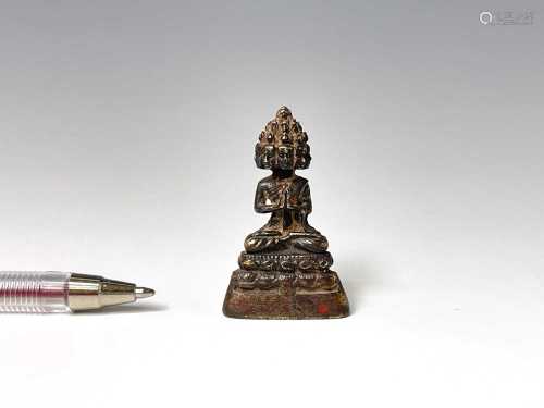 A miniature bronze of a seated buddha, 18th/19th century, ca...
