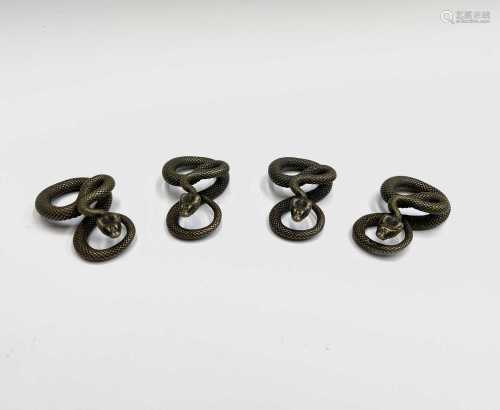 A group of four Indian brass small figures of cobras, width ...