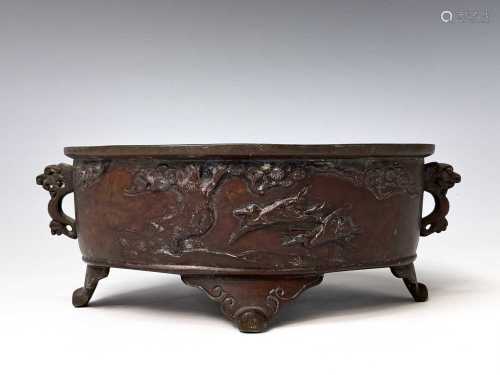 A Japanese bronze twin handled censer, Meiji Period, with bi...