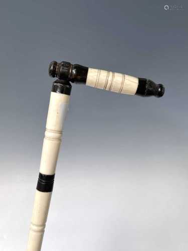 An Anglo Indian ivory and horn walking stick, 19th century, ...