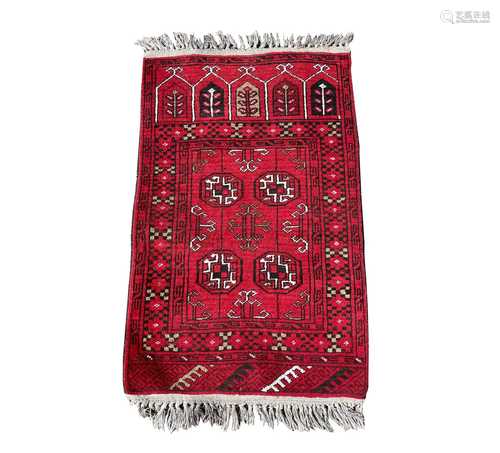 An Afghan prayer rug, mid 20th century, with four octagonal ...