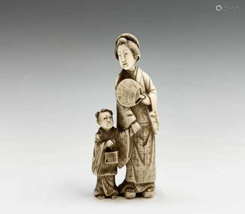 A Chinese carved ivory group of a mother and child, 19th cen...