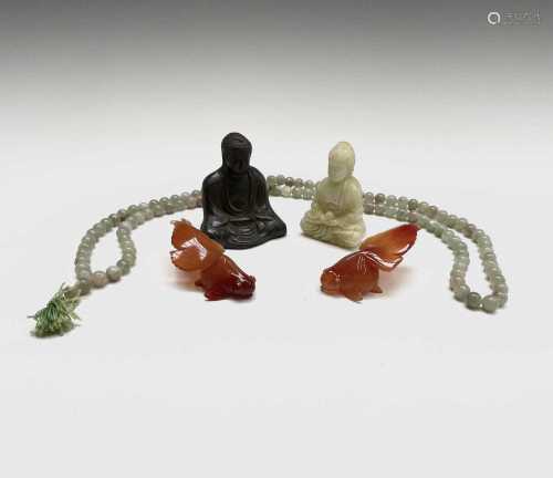 A string of jade beads, of varied colour, two carnelian gold...