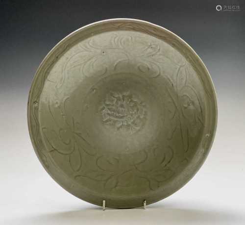 A Chinese Chekian Celadon dish, late Ming period, decorated ...