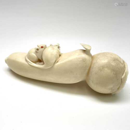 A Japanese carving of mice and fruit, Meiji period, height 3...