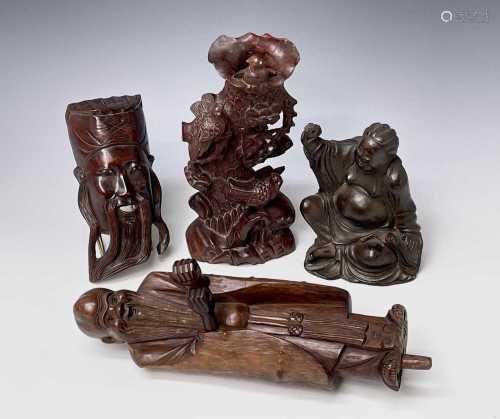 A Chinese hardwood figure, carved as a bearded immortal, wit...