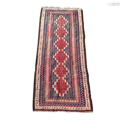 A Senneh kelim long rug, circa 1920, the indigo field with s...