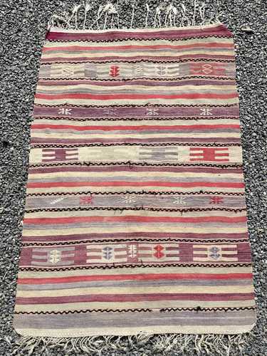 A Persian kelim rug, with multiple horizontal polychrome ban...