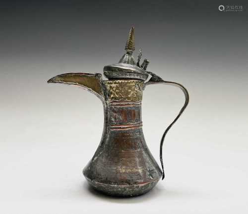 A Saudi Arabian brass and silvered copper dallah pot, 18th/1...