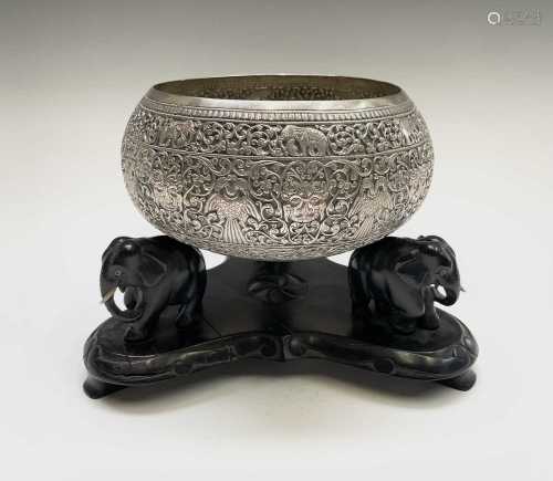 An Indian silver bowl, 19th century, on an ebonised stand ca...